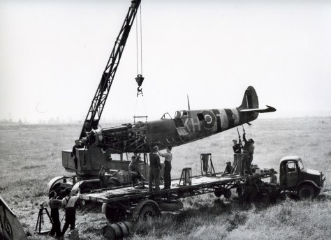 This is a wartime taken photo of RCAF techs recovering a crashed Spitfire
